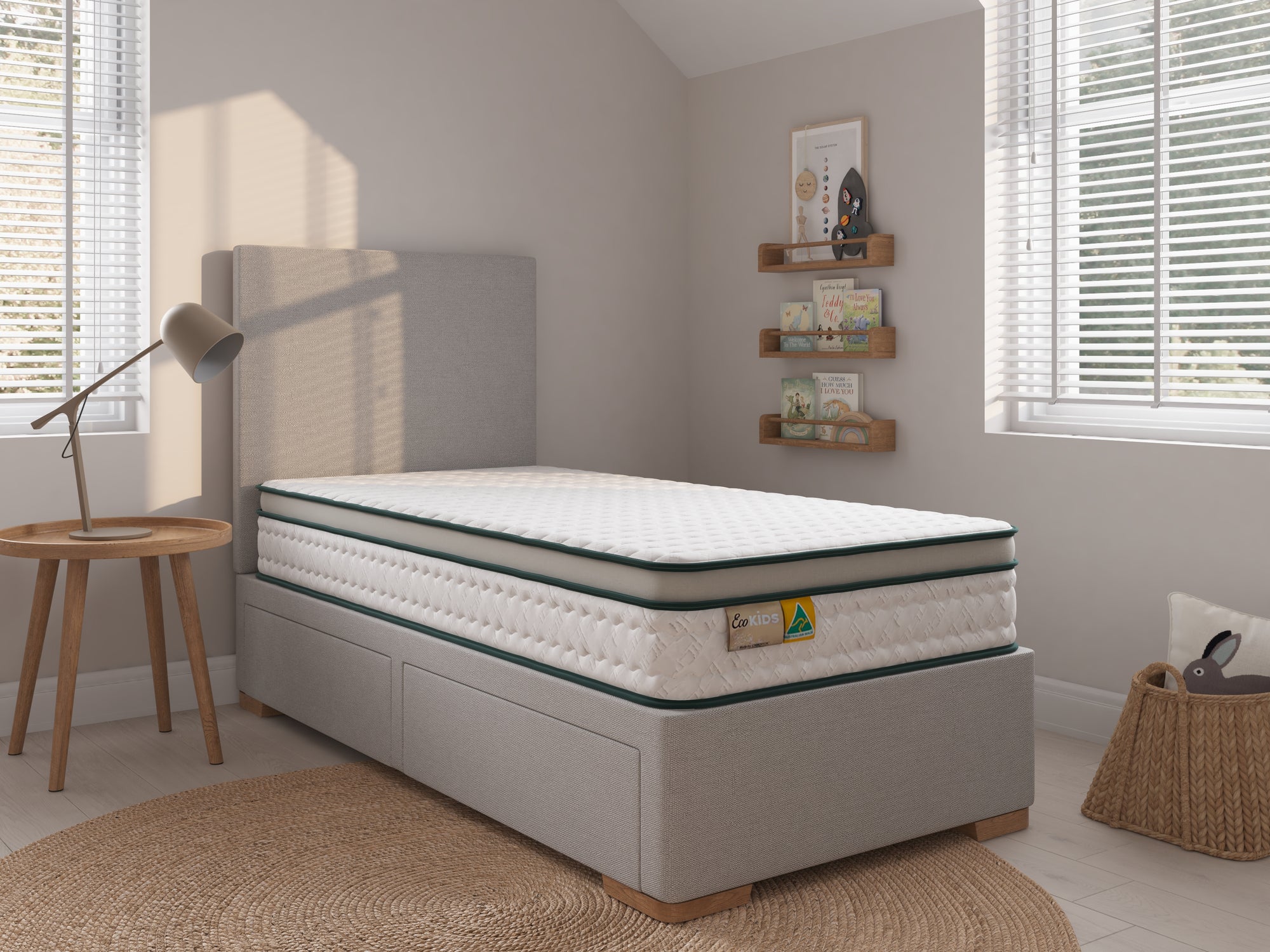 Mattress on a bed frame in a bedroom setting with decor elements.
