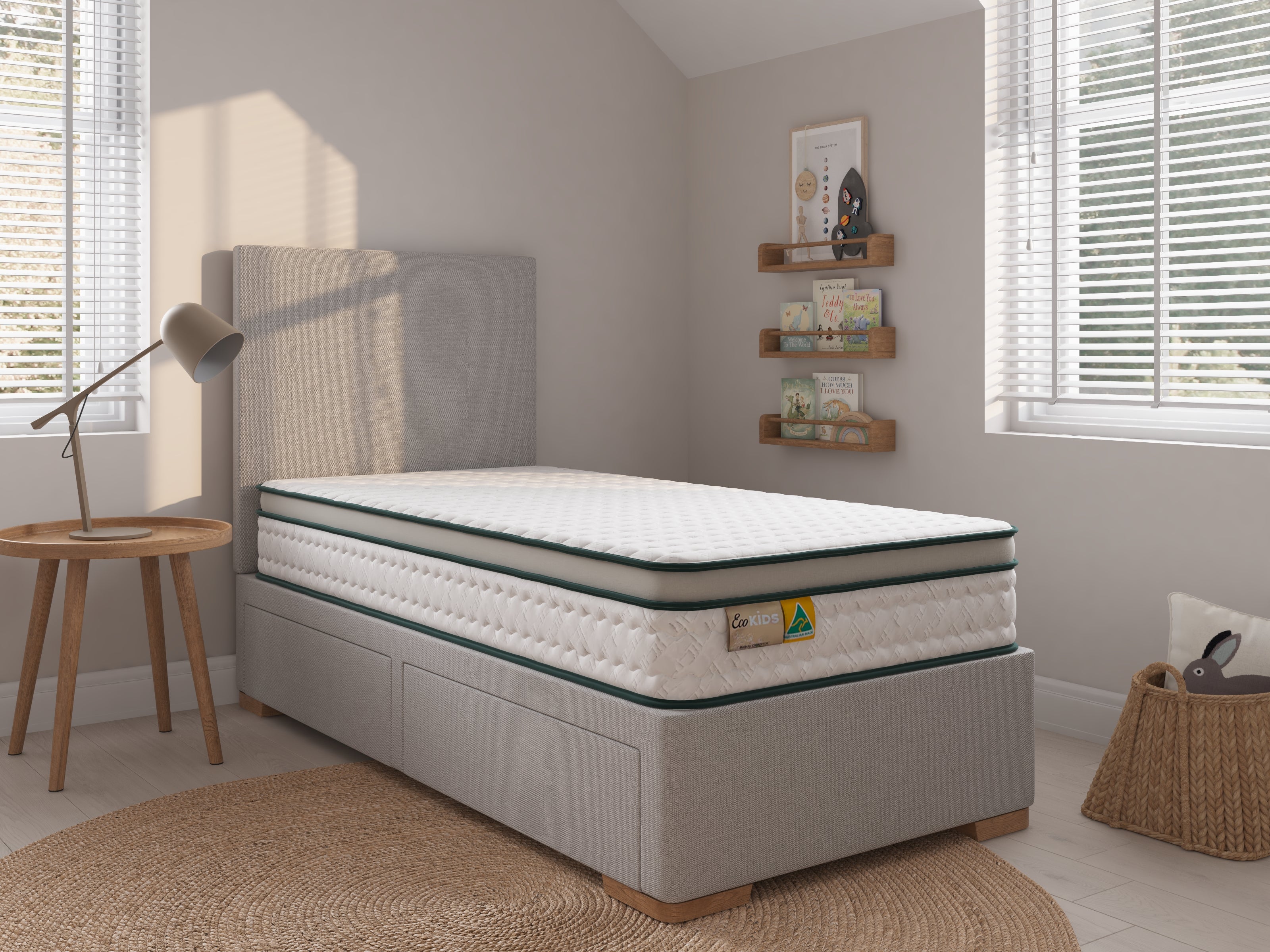 Mattress on a bed frame in a bedroom setting with decor elements.