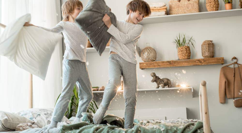 kids playing on bed